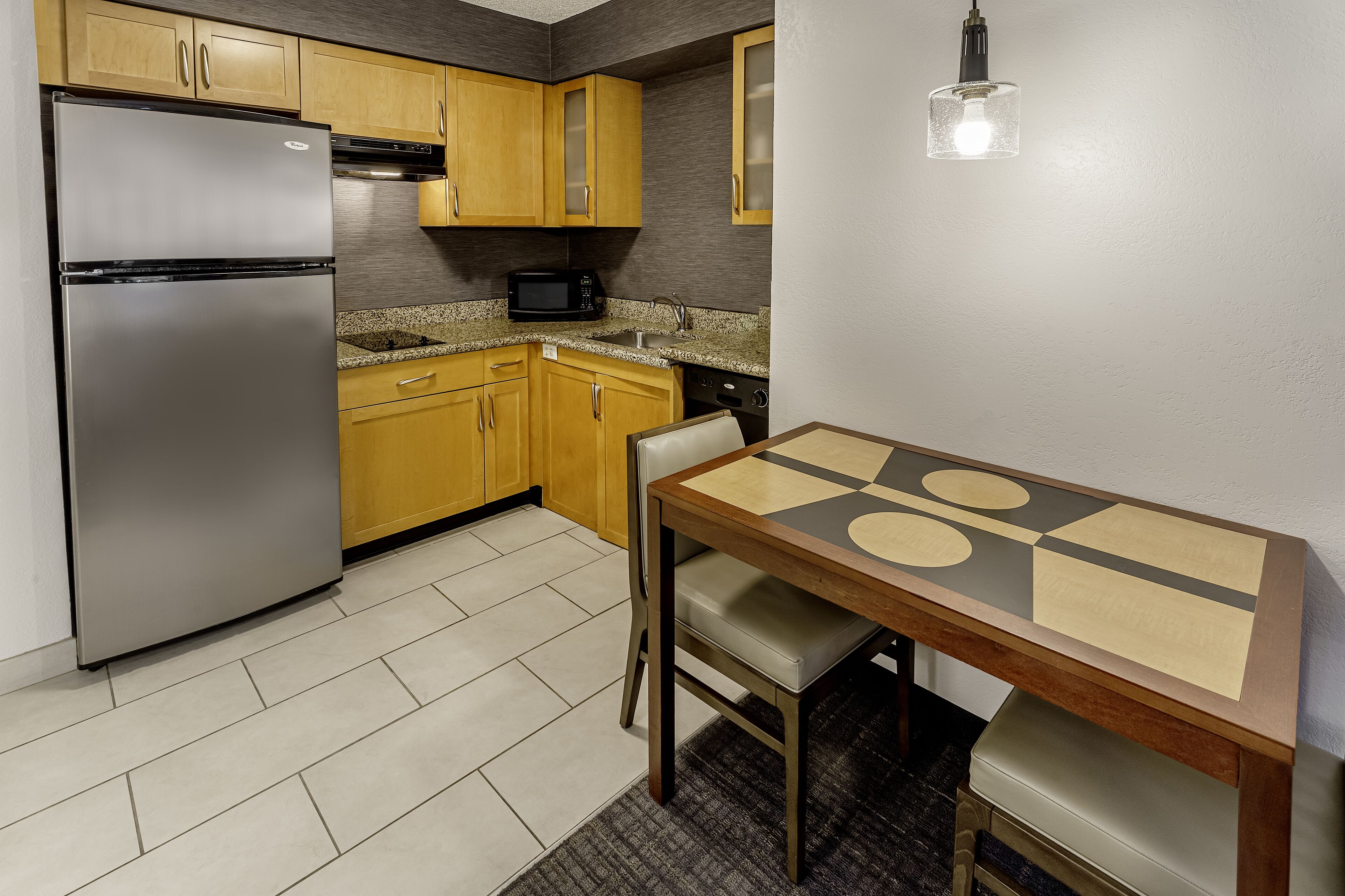 full-sized fridge, microwave, stovetop, dishwasher