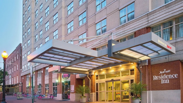 A Marriott Residence Inn with a covered entrance, outdoor seating area, and a brick facade. - Residence Inn by Marriott Washington, DC/Dupont Circle (Washington)