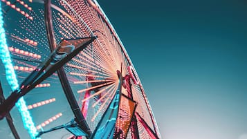 A large Ferris wheel with a clear sky in the background.