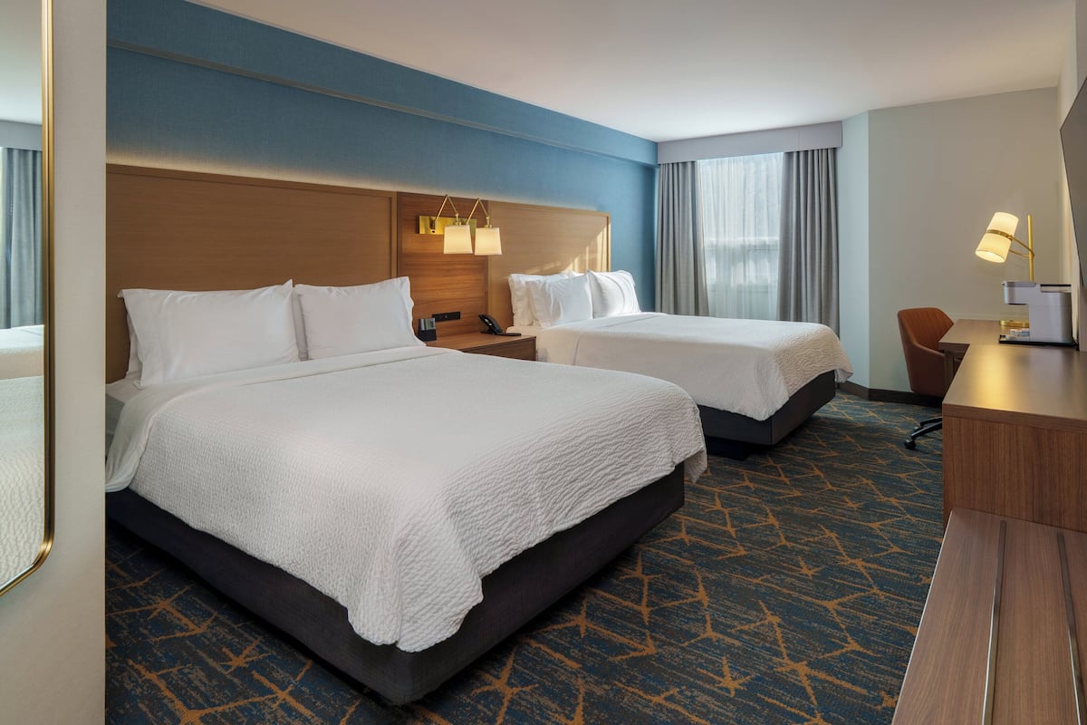 Hypo-allergenic bedding, pillowtop beds, desk, blackout drapes