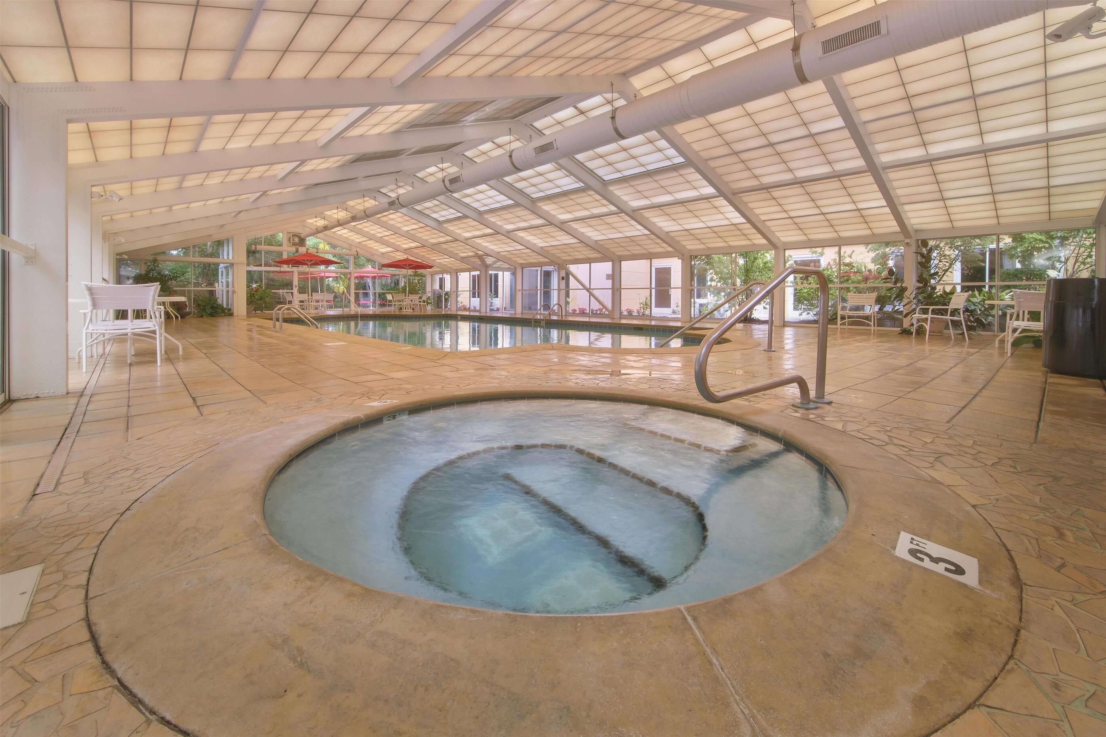 indoor pool, a heated pool, pool loungers