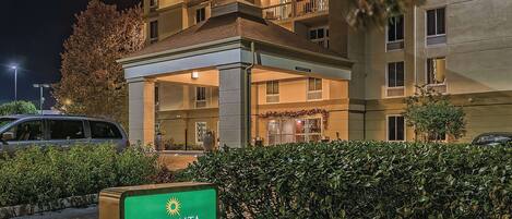 A hotel entrance with a sign reading "La Quinta."