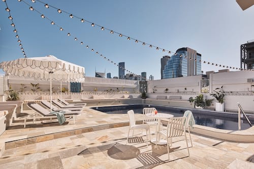 Outdoor pool, open 6:00 AM to 9:00 PM, pool loungers