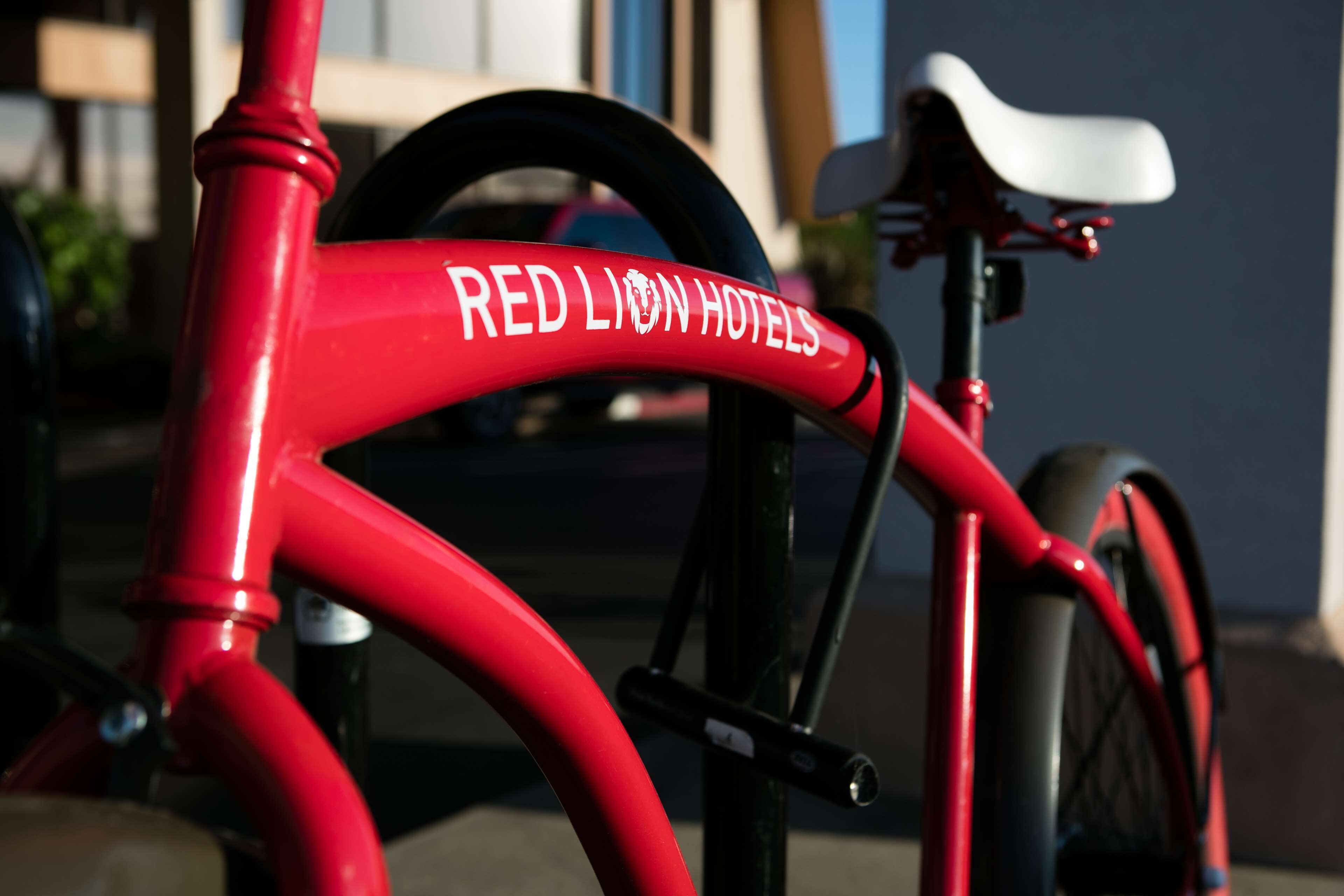 A red bicycle with "RED LION HOTELS" written on the frame.