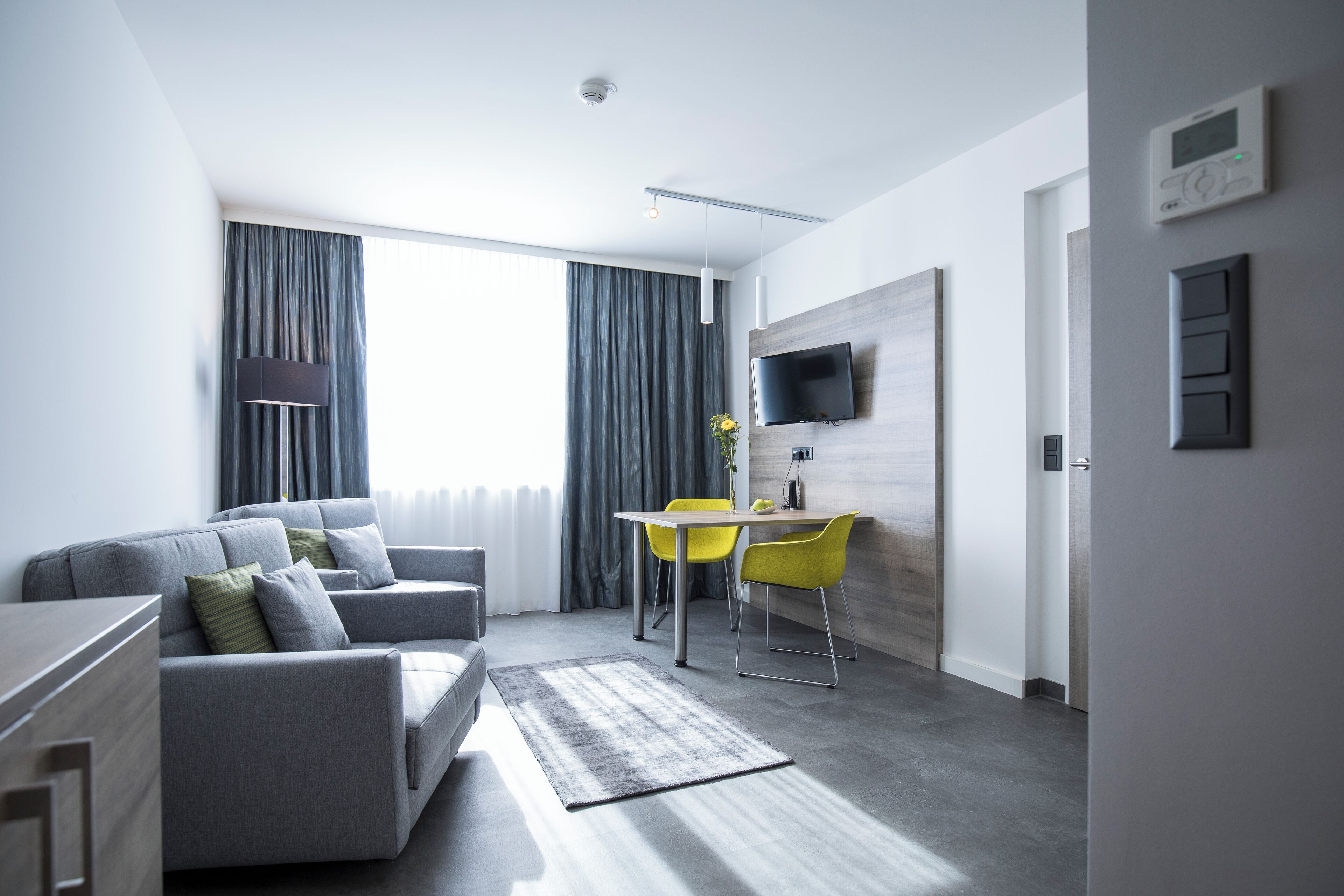 executive suite, multiple beds | living area | lcd tv