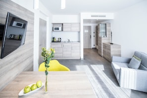 Executive Suite, Multiple Beds | Living area | LCD TV