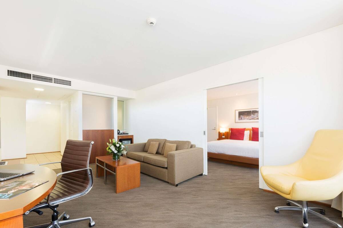 Suite, 1 King Bed, Balcony | In-room safe, desk, laptop workspace, blackout drapes