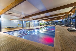 Indoor pool, a heated pool, open 6:00 AM to 10:00 PM, sun loungers