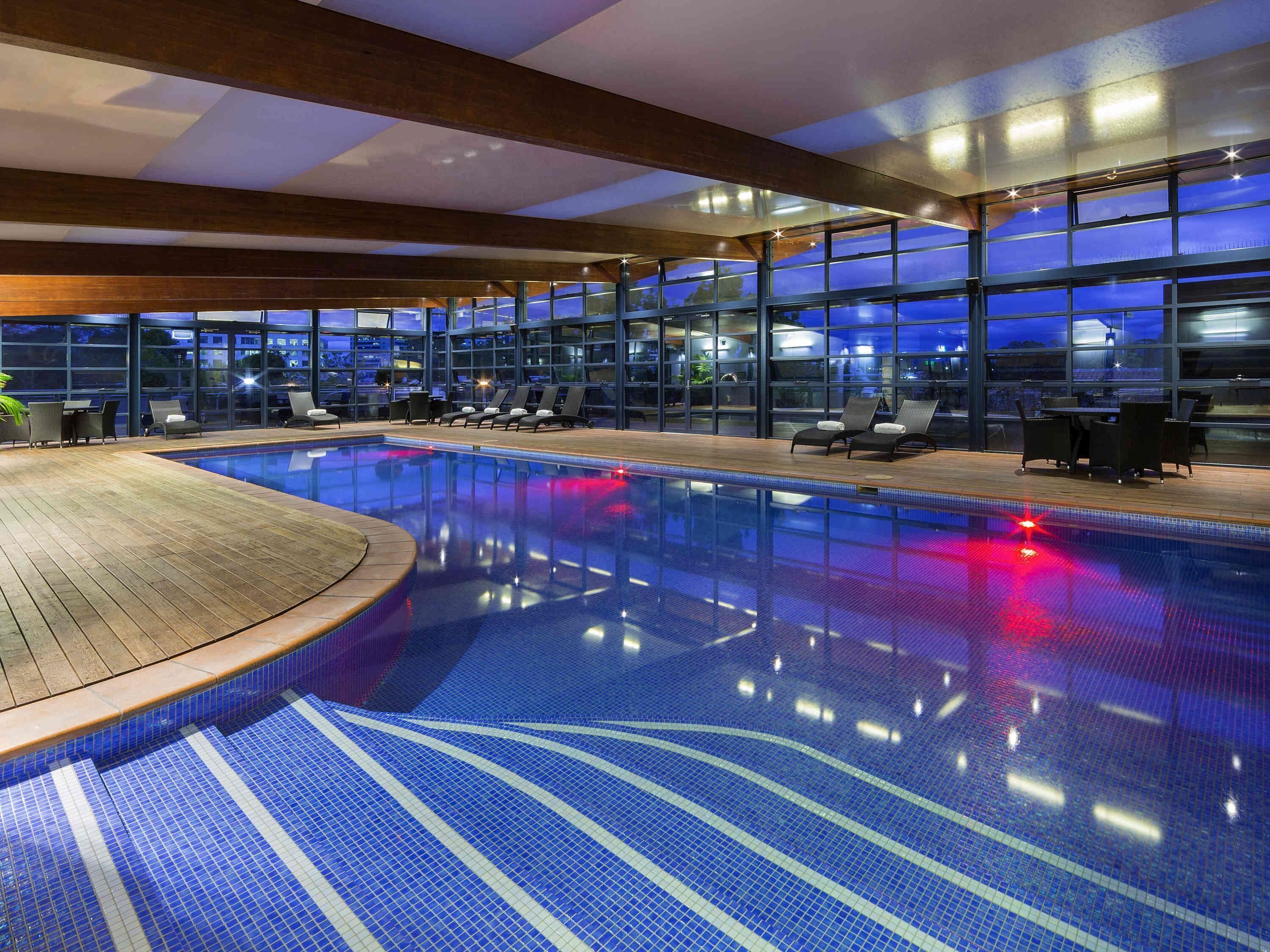 Indoor pool, a heated pool, open 6:00 AM to 10:00 PM, sun loungers