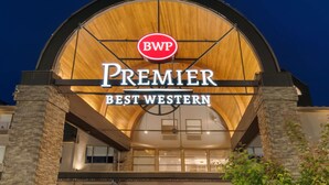 A hotel entrance with a large arched wooden facade, a prominent 'BWP Premier Best Western' sign, and stone pillars. - Best Western Premier Aberdeen Kamloops (Kamloops)