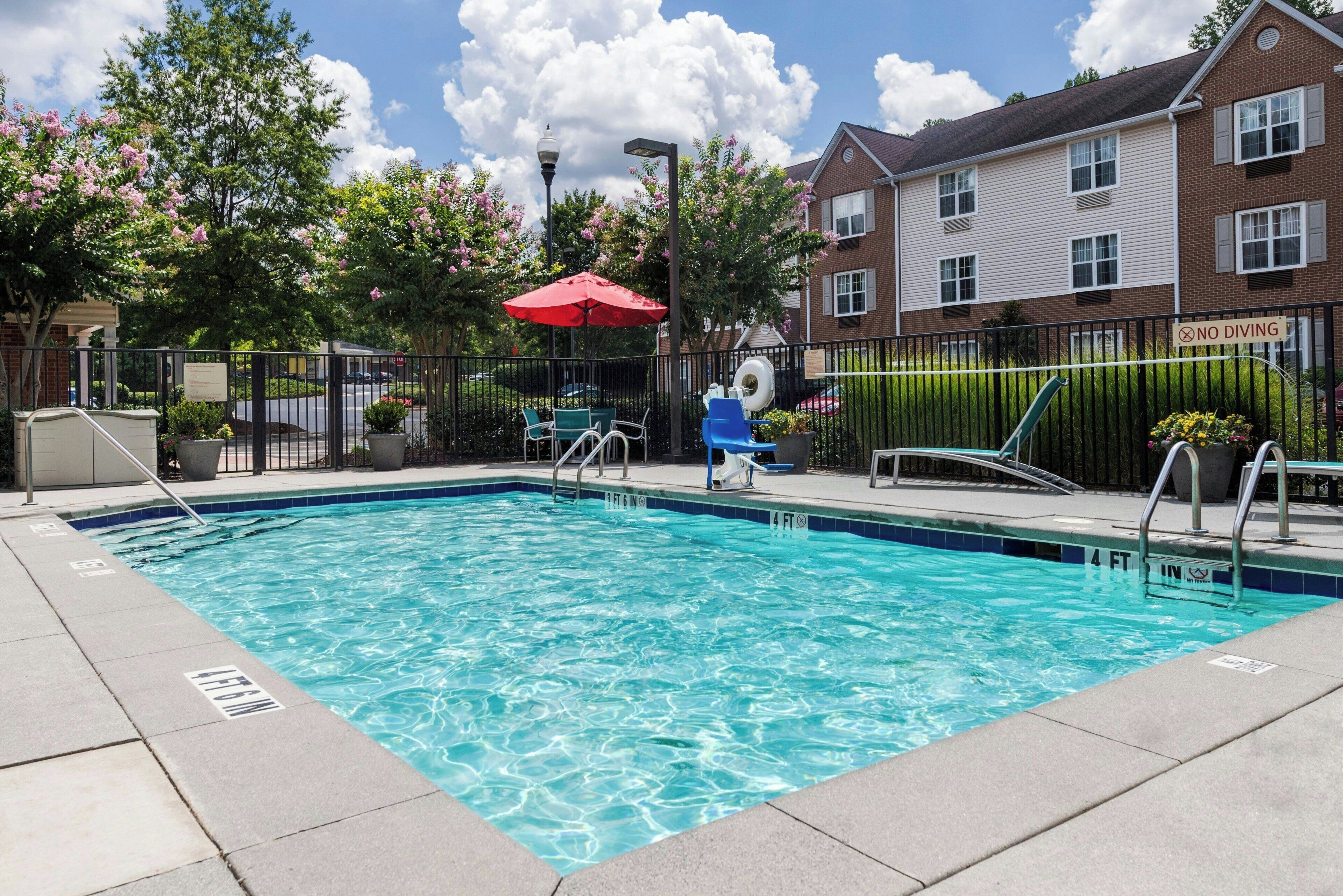 seasonal outdoor pool, open 10:00 am to 10:00 pm, pool umbrellas