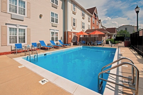 Seasonal outdoor pool, open 10:00 AM to 10:00 PM, pool umbrellas