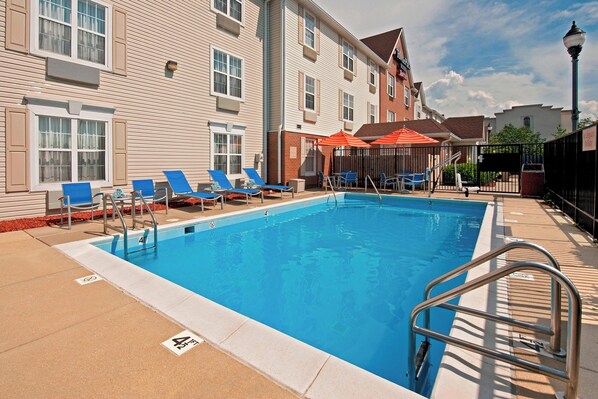 Seasonal outdoor pool, open 10:00 AM to 10:00 PM, pool umbrellas