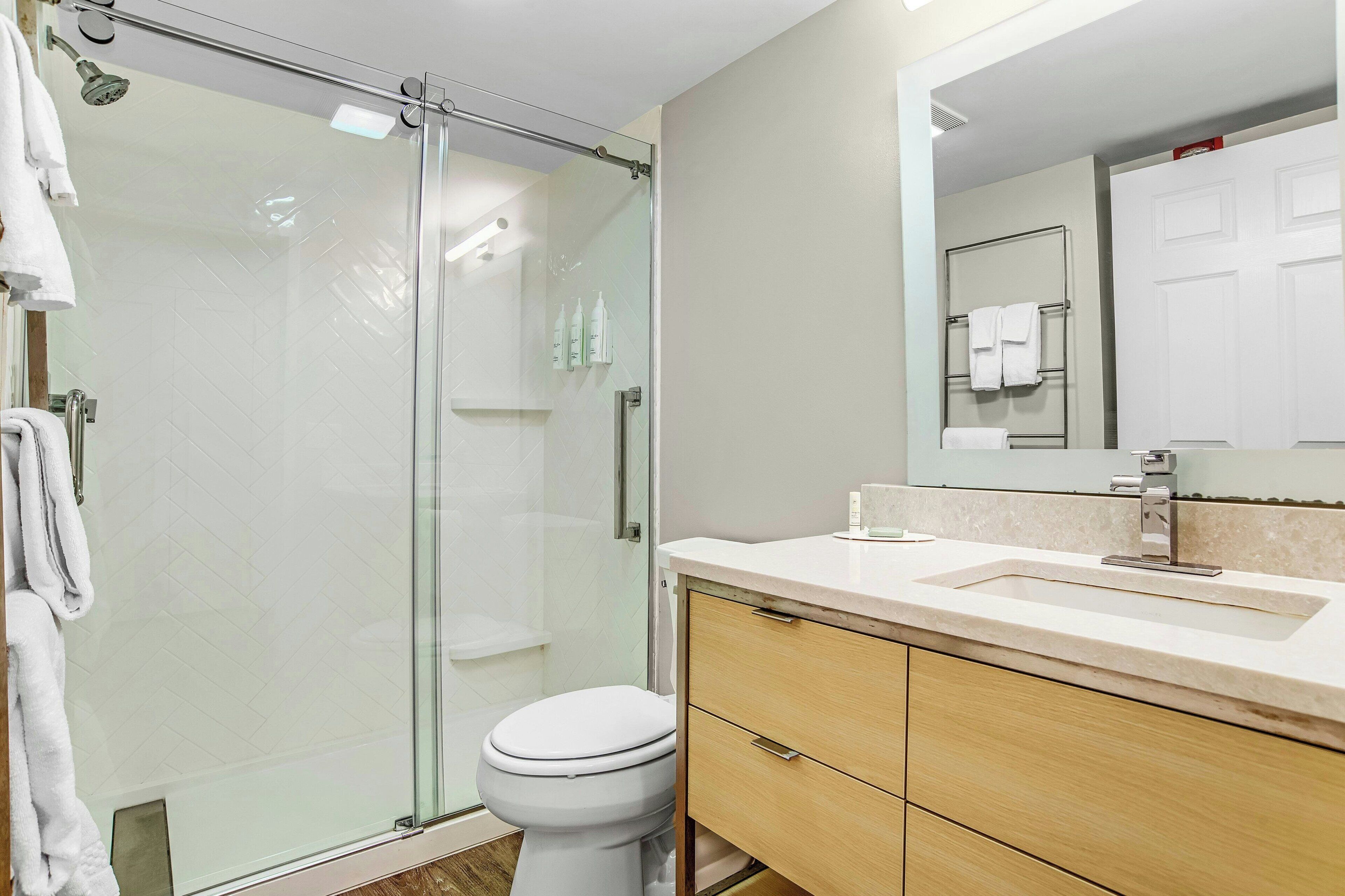 pillow-top beds, desk, laptop workspace, blackout curtains