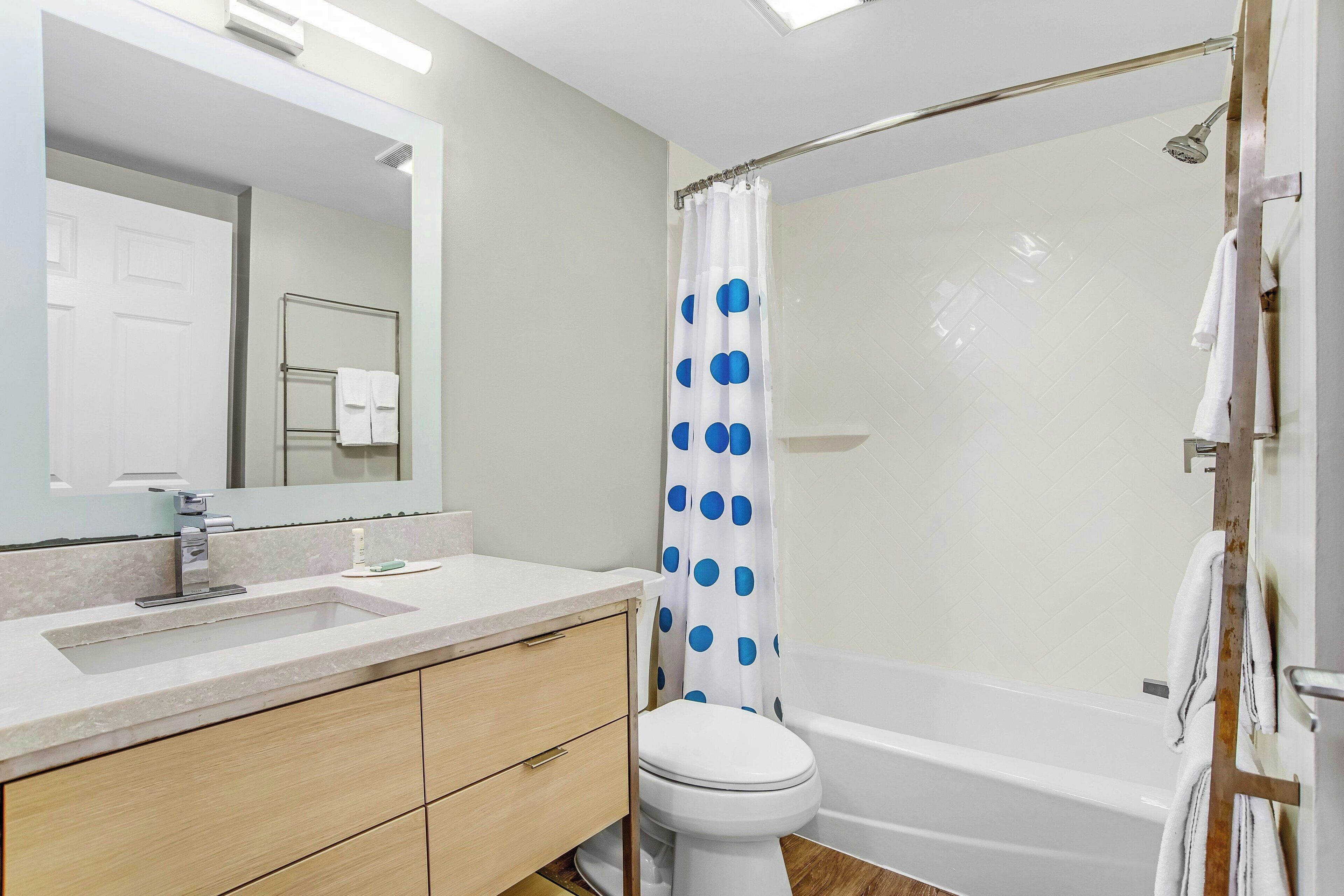 pillow-top beds, desk, laptop workspace, blackout curtains