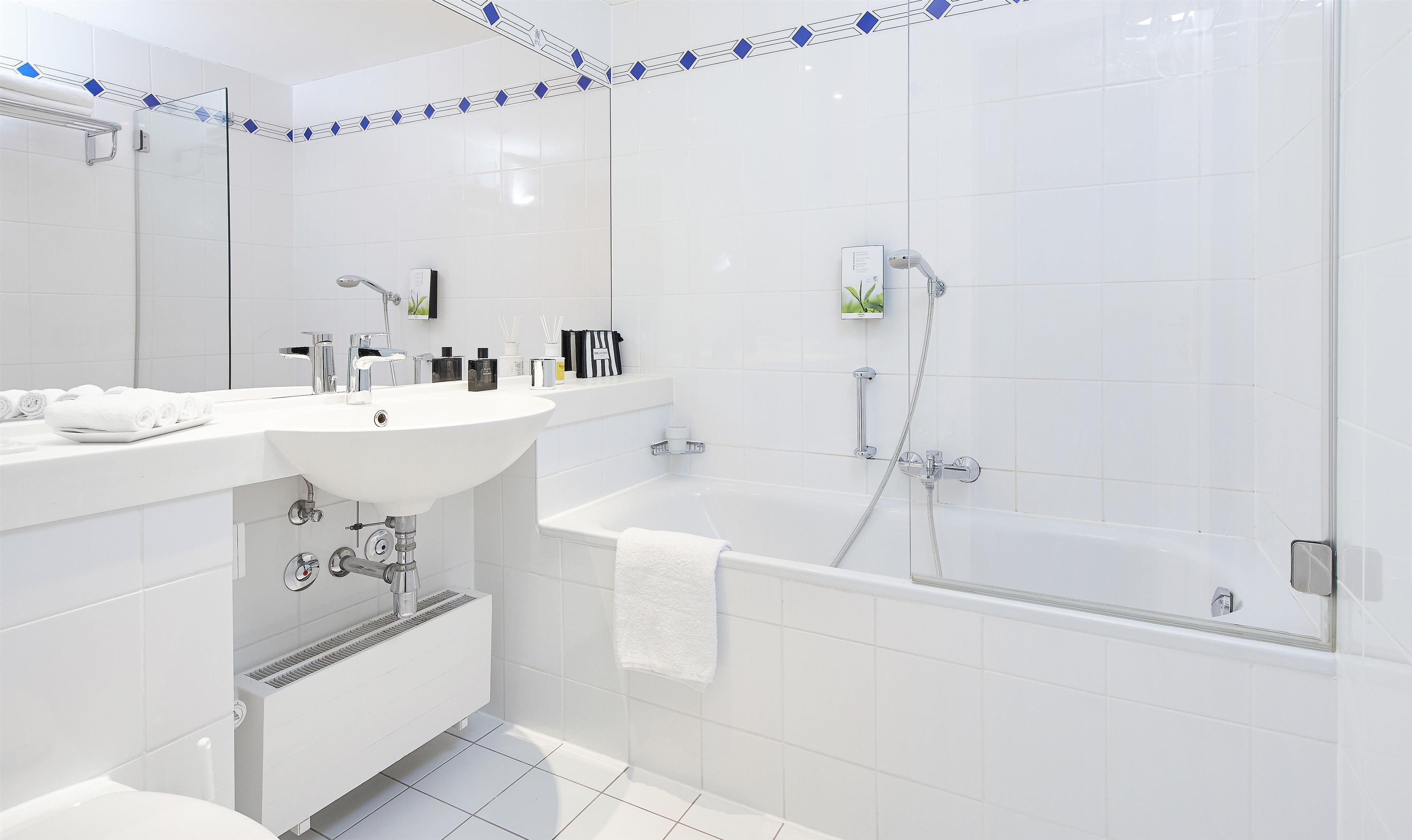 eco-friendly toiletries, hair dryer, bidet, towels