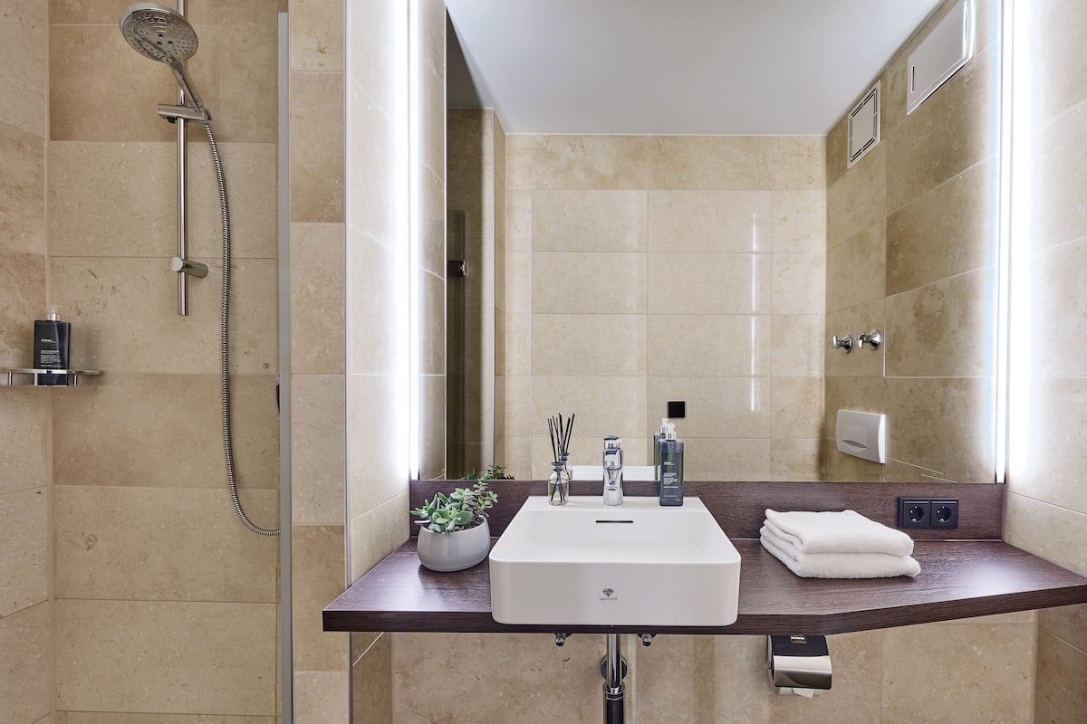 shower, eco-friendly toiletries, hair dryer, towels