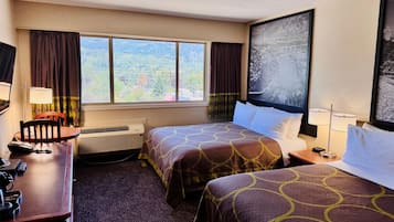 Desk, blackout drapes, iron/ironing board, free cribs/infant beds