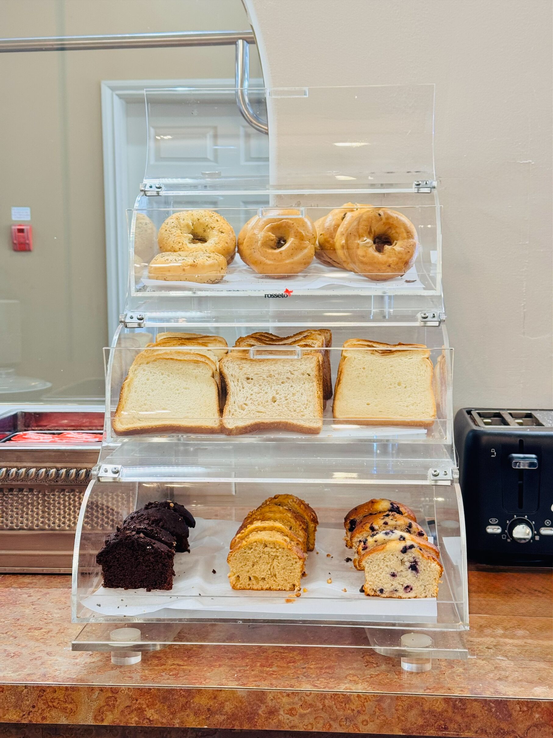 A bakery display case with various baked goods.