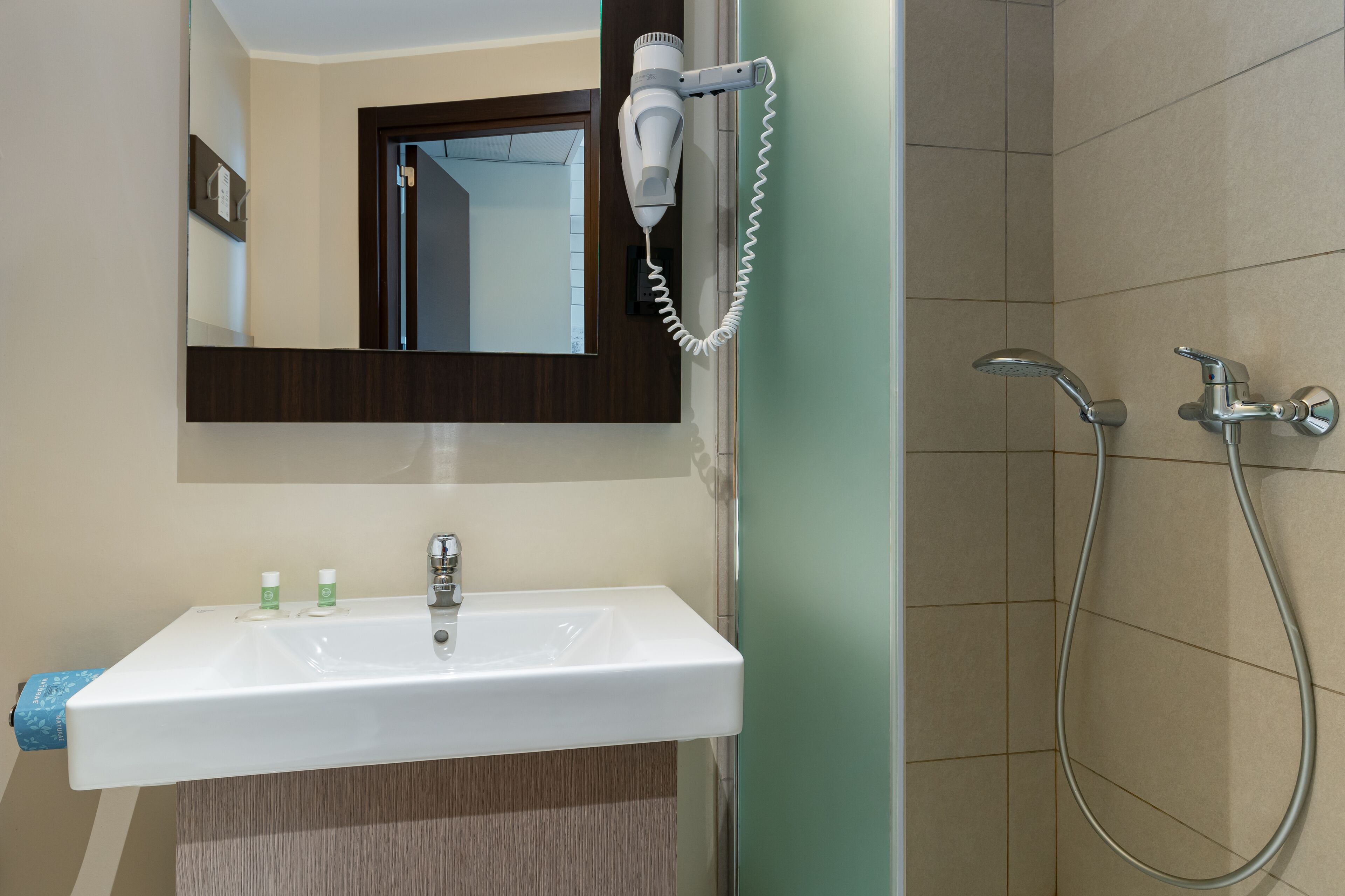 shower, hair dryer, bidet, towels