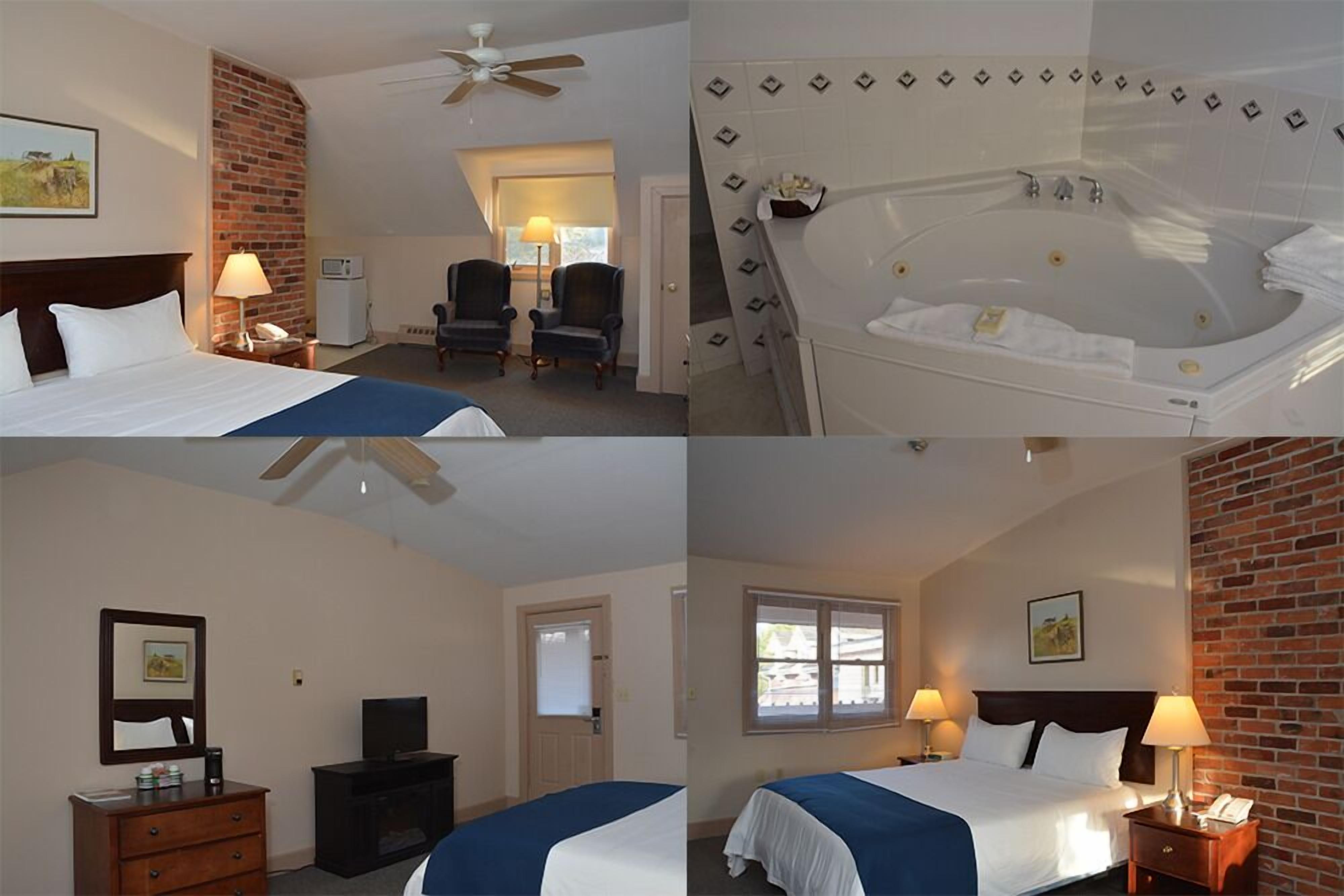 Une chambre d’hôtel comprenant un lit, un bureau, une chaise, une télévision, une lampe de bureau, un téléphone, une fenêtre et une salle de bain avec une baignoire.