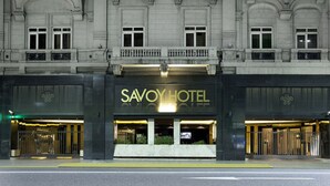 The exterior of the Savoy Hotel with its classic architecture and prominent signage. - Savoy Hotel (Buenos Aires)