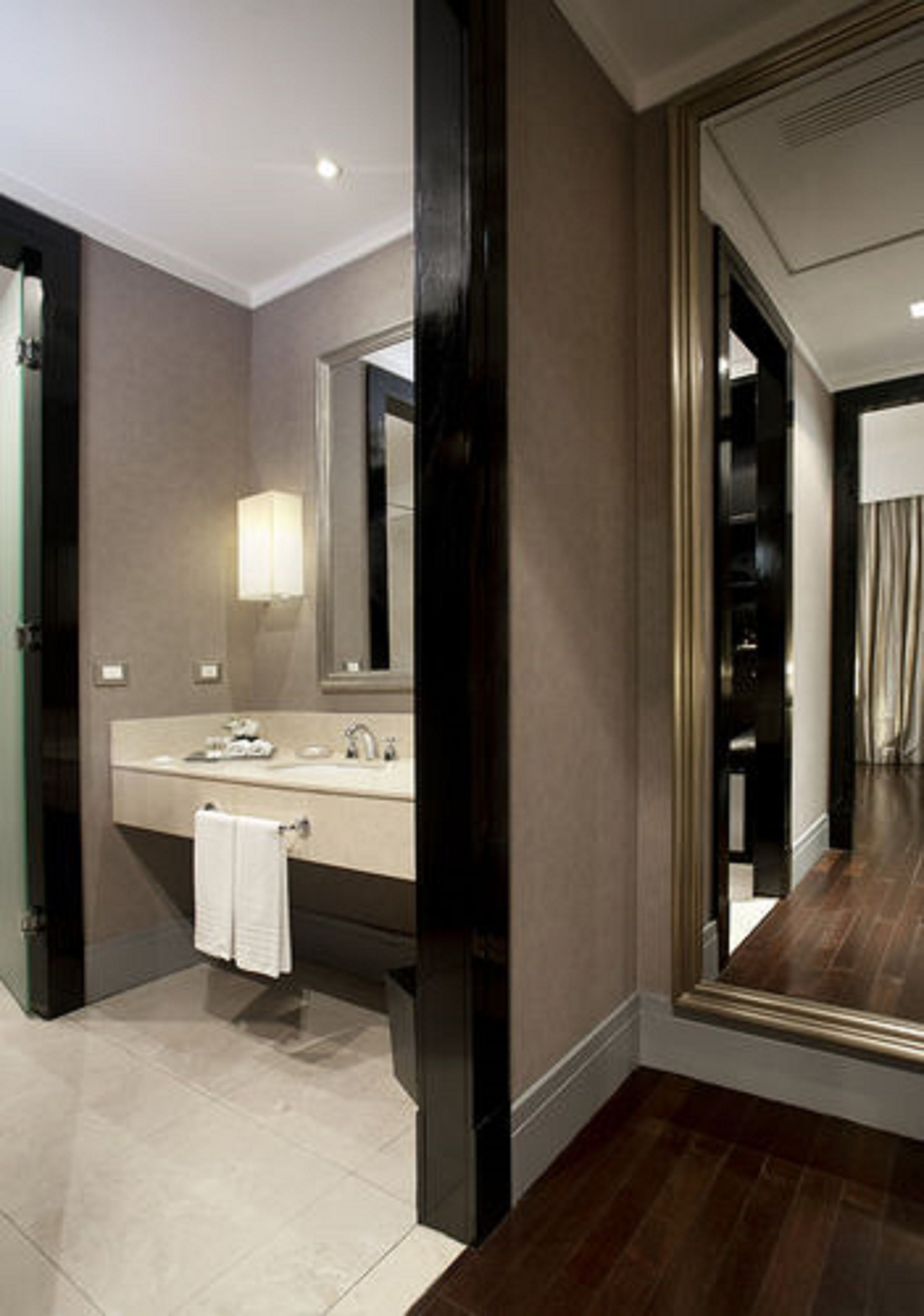 designer toiletries, hair dryer, bidet, towels