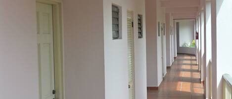 A corridor with doors numbered 213, leading to rooms.
