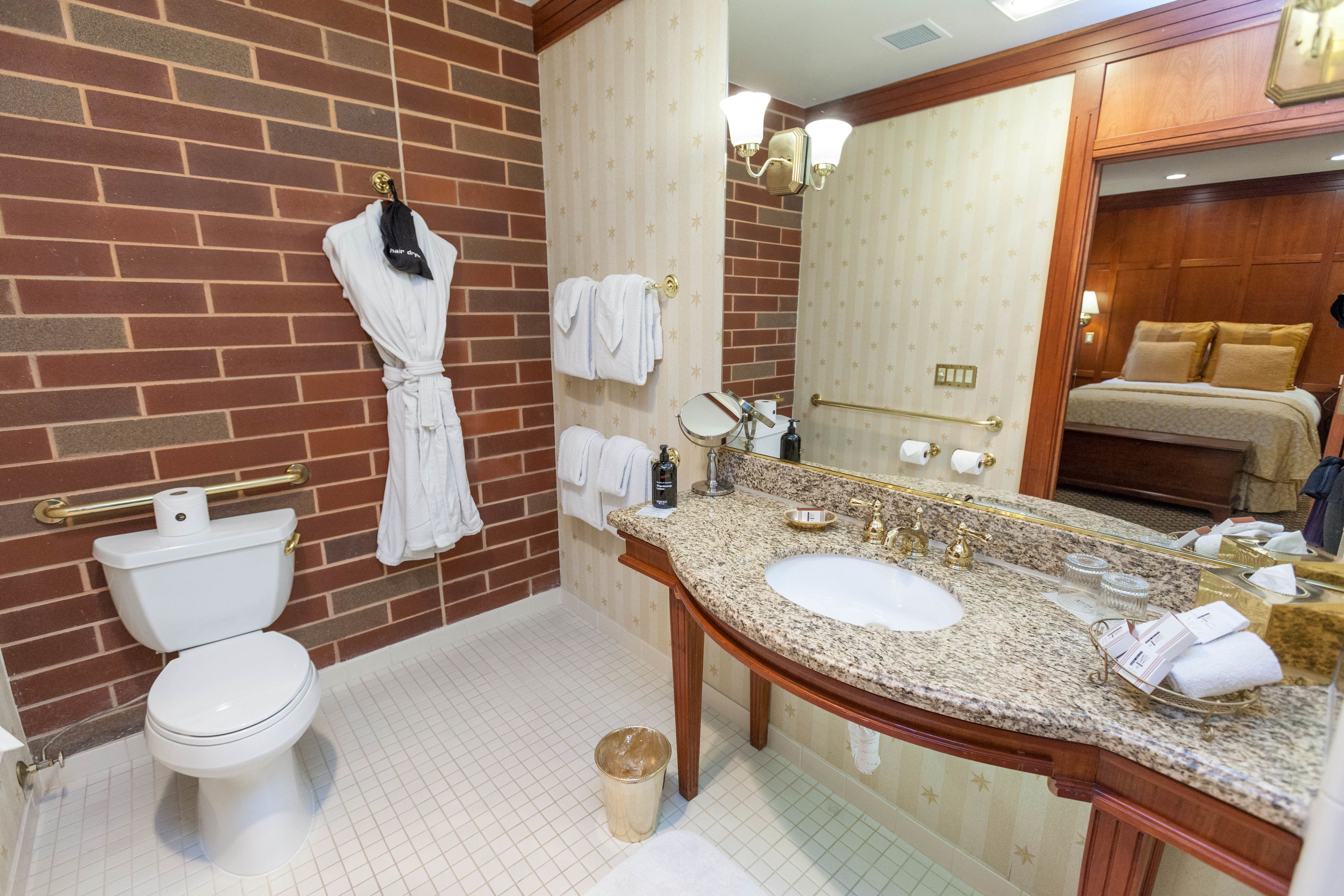 designer toiletries, hair dryer, bathrobes, slippers