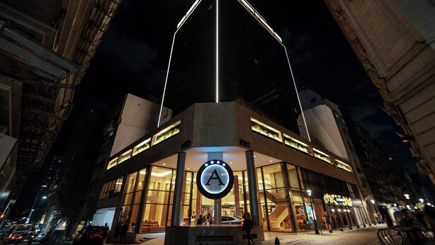 A modern hotel with a prominent 'A' logo, large windows, and a central atrium. - Amérian Buenos Aires (Buenos Aires)