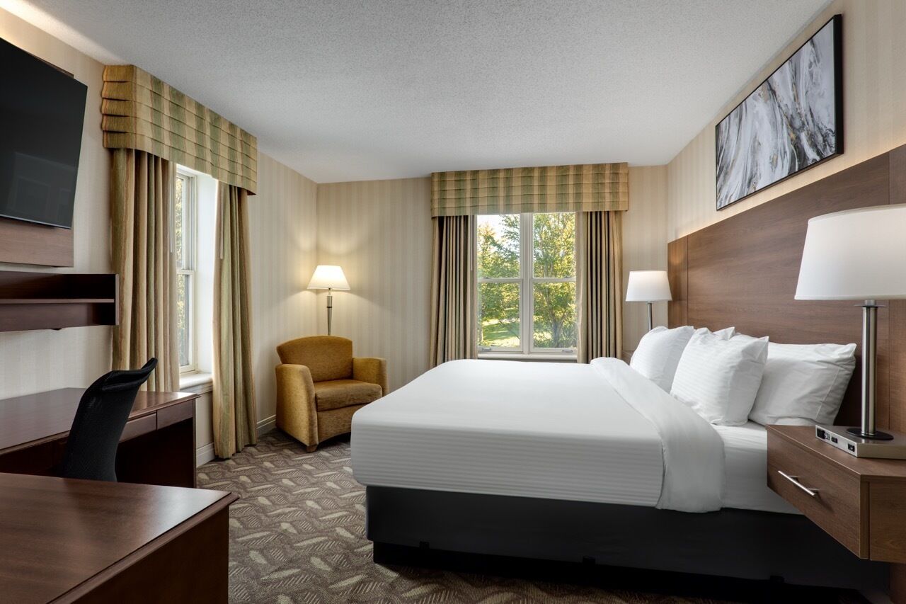 Desk, laptop workspace, blackout drapes, iron/ironing board