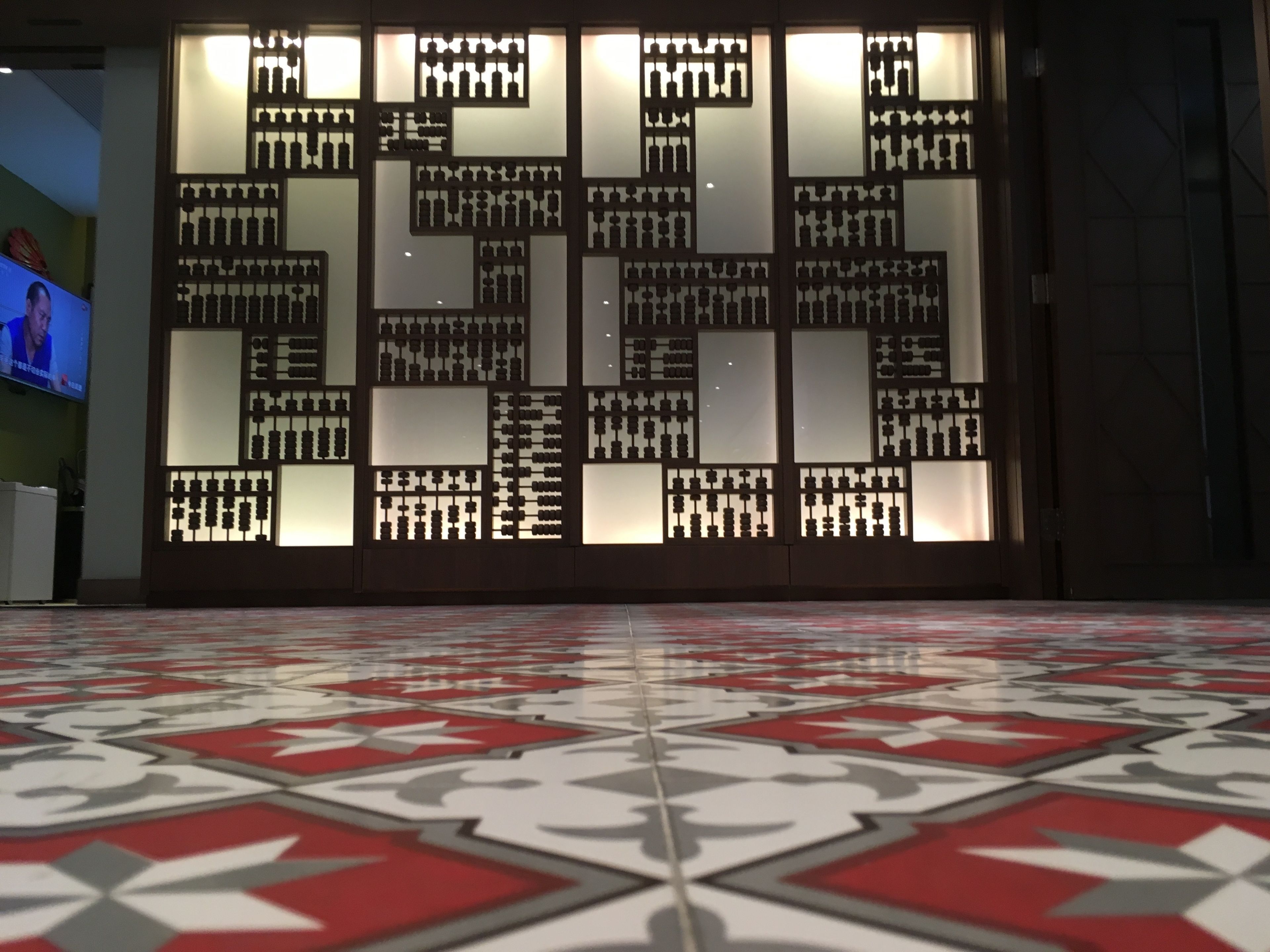 A patterned floor with a geometric design.