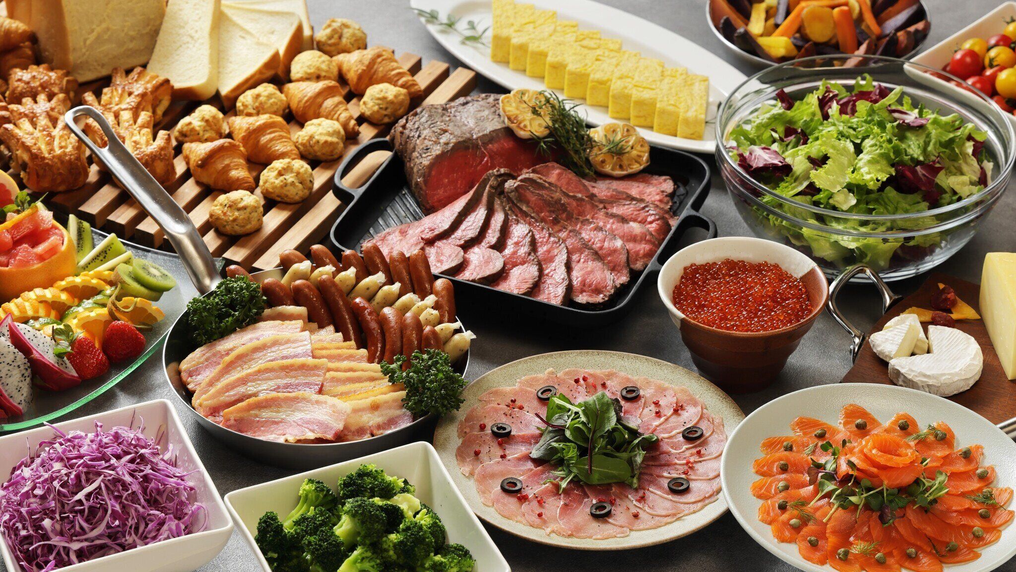 A variety of food items including meats, cheeses, and vegetables.