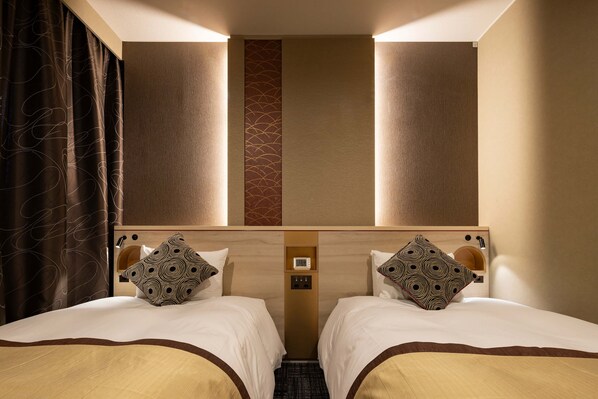 Economy Twin Room, Non Smoking | Down duvets, desk, soundproofing, iron/ironing board