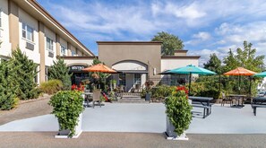 A hotel entrance with outdoor seating, a bistro, and a boxing ring. - Inn on Prince Hotel & Conference Centre, an Ascend Collection Hotel (Truro)