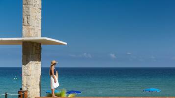Seasonal outdoor pool, open 10:00 AM to 8:00 PM, pool umbrellas