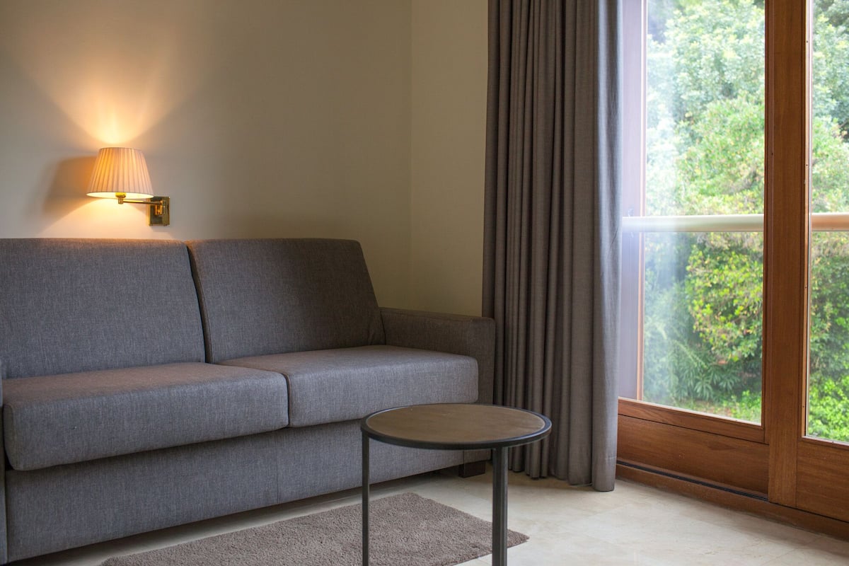 family room, balcony, garden view | 1 bedroom, premium bedding, minibar, in-room safe