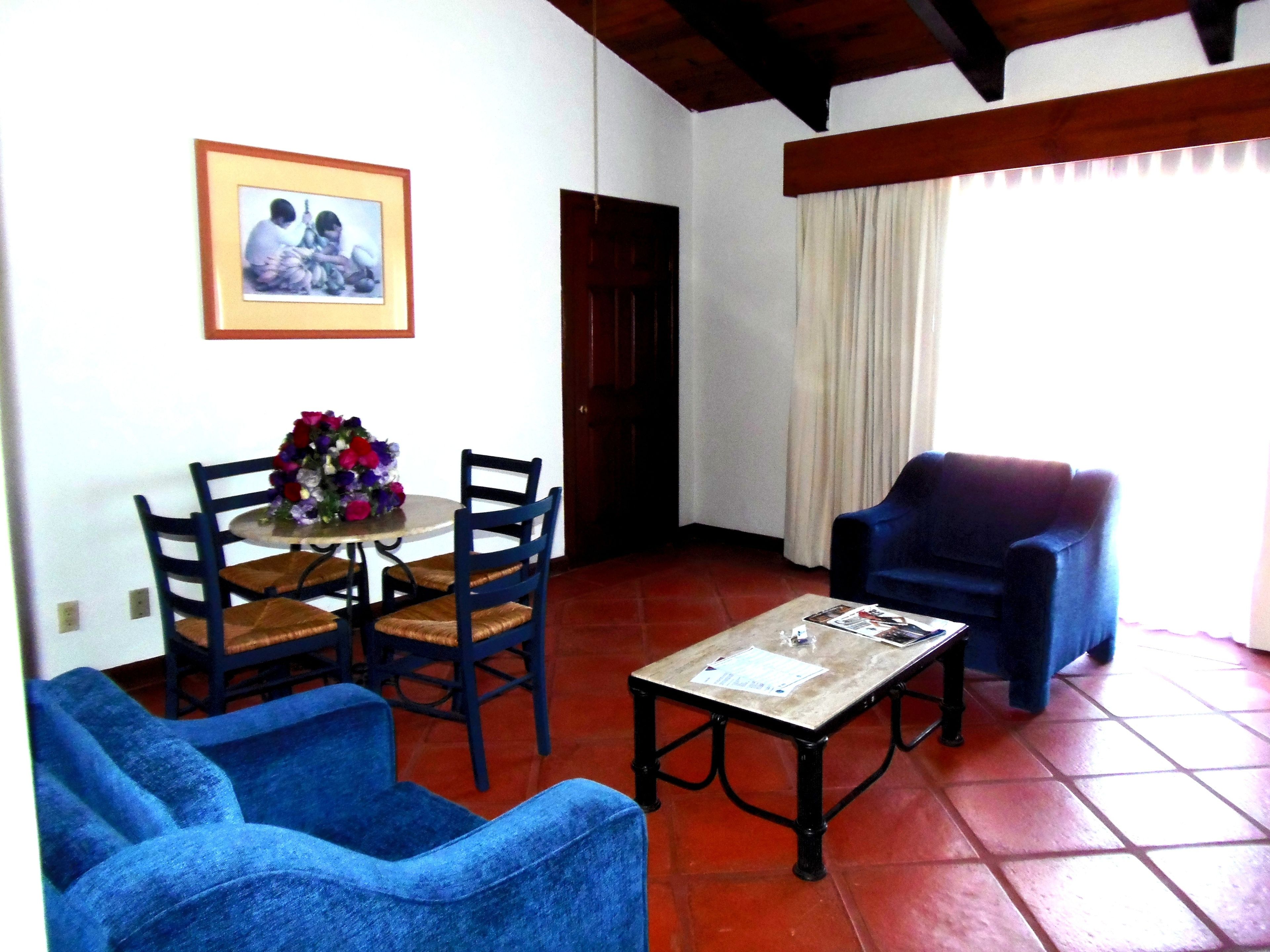 junior suite | in-room safe, desk, blackout curtains, iron/ironing board