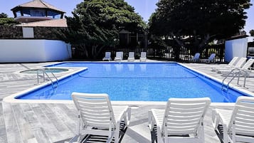 Outdoor pool, pool umbrellas, sun loungers