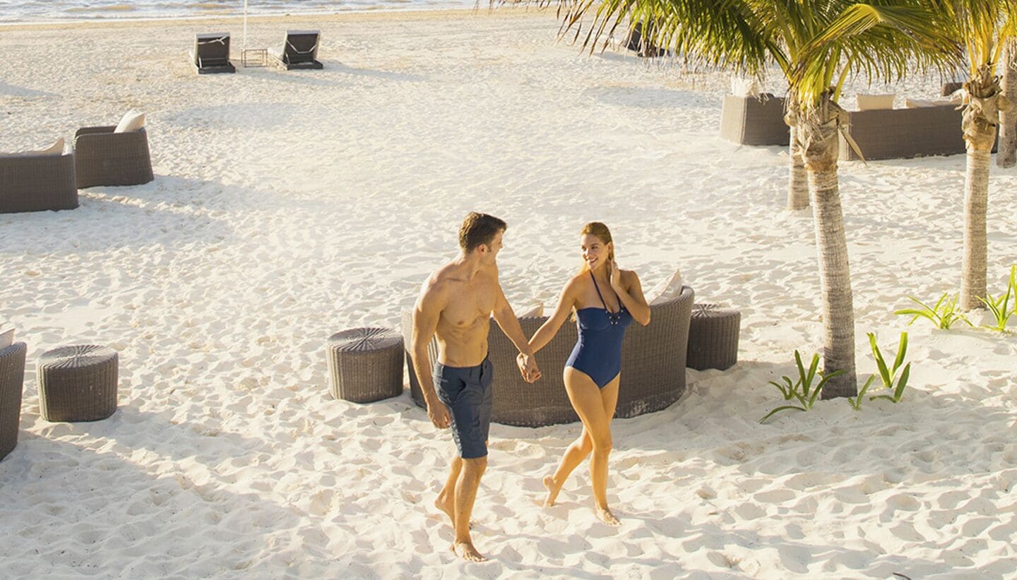On the beach, white sand, sun-loungers, beach umbrellas
