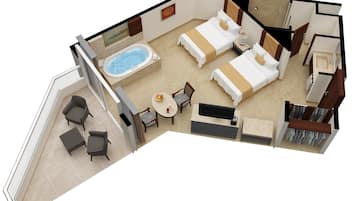 Habitació d'hotel amb un balcó, zona de seients amb taula i cadires, dos llits, televisió i un bany amb plat de dutxa i vàter.