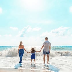 On the beach, white sand, sun loungers, beach umbrellas