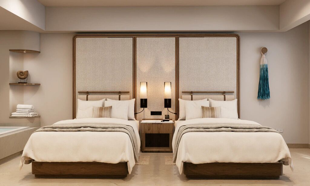 Une chambre avec un grand lit, un grand miroir, des lampes de chevet et une petite étagère avec des serviettes.