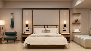 A modern bedroom with a large bed, bedside tables, a chair, a lamp, a wall-mounted light, and a small shelf with towels.