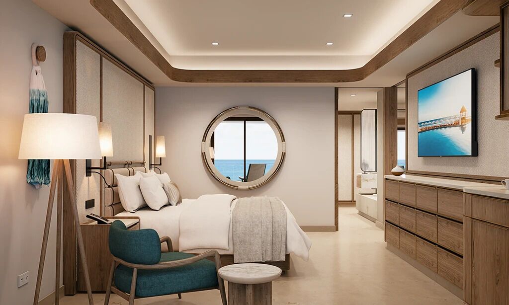 A modern hotel room with a bed, seating area, TV, and a large window.