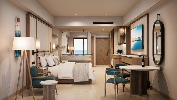 A modern hotel room with a large bed, a sitting area with chairs, a dining table, and a view of the sea through the window.