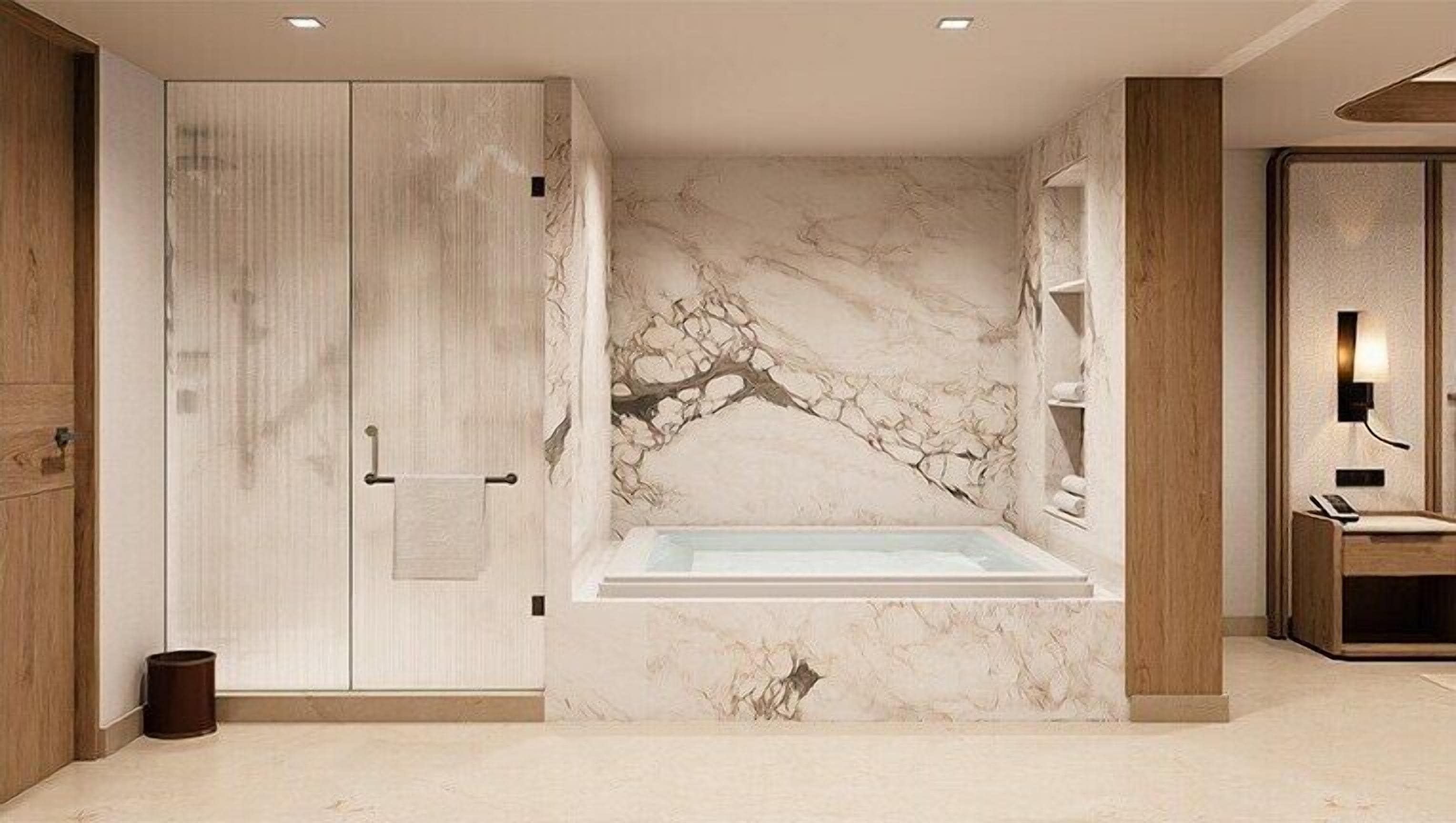 A bathroom with a marble wall, a bathtub, wooden cabinets, and a towel rack.