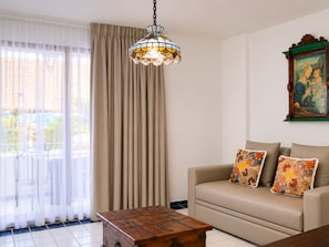 Junior Suite, 1 King Bed | In-room safe, individually decorated, blackout drapes