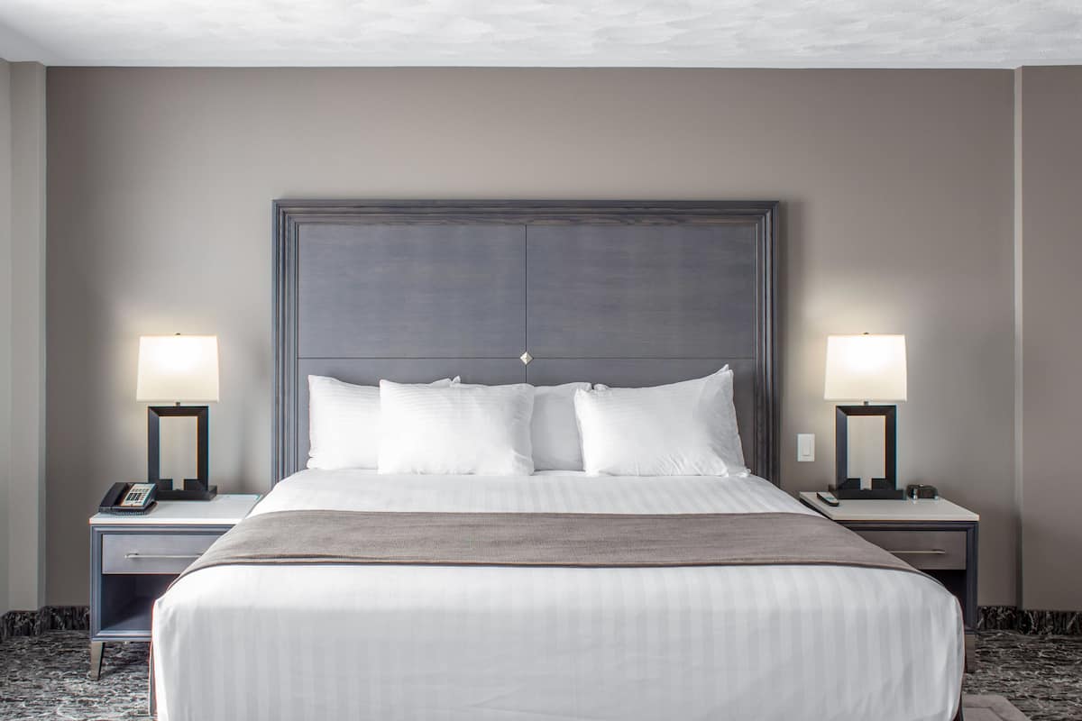 desk, laptop workspace, blackout curtains, iron/ironing board