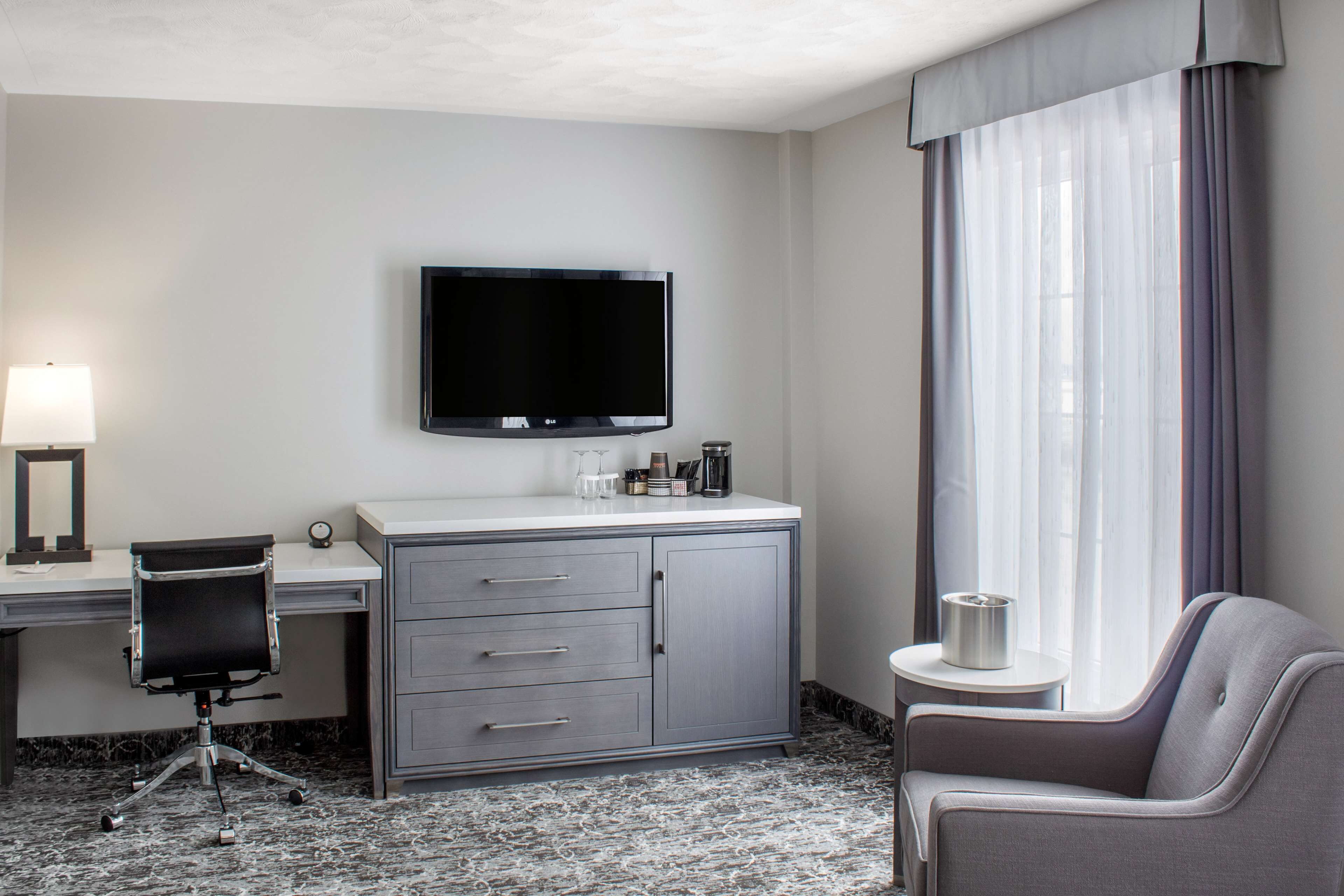 desk, laptop workspace, blackout curtains, iron/ironing board